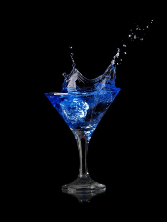 Splashing glass isolated on a black backgroundの写真素材