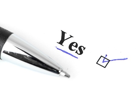 yes and pen isolated on a white backgroundの写真素材