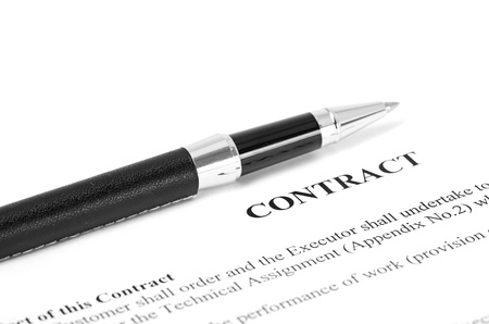 Close-up of silver pen on contract  isolatedの写真素材