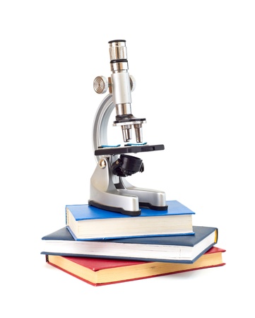 Microscope, books isolated on a white backgroundの写真素材