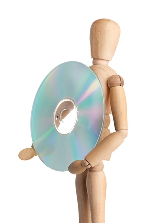 Wooden doll carries data storage media, CD or DVDの写真素材