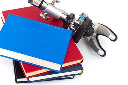 Microscope, books isolated on whiteの写真素材