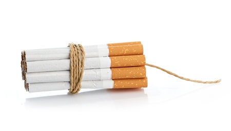 Cigarettes tied with rope and wick isolated on whiteの写真素材