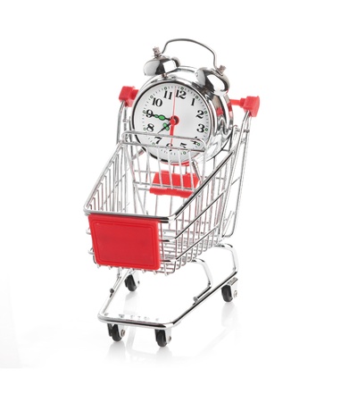 Buying time concept with clock and shopping cartの写真素材