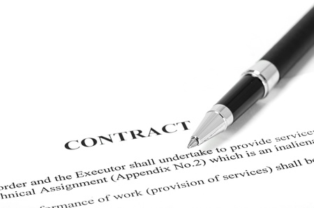 Close-up of silver pen on contract の写真素材