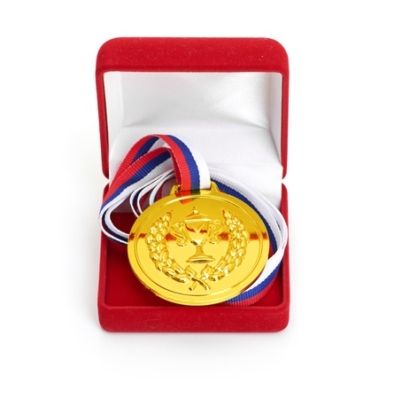 Golden medal in red gift box  isolated on white backgroundの写真素材