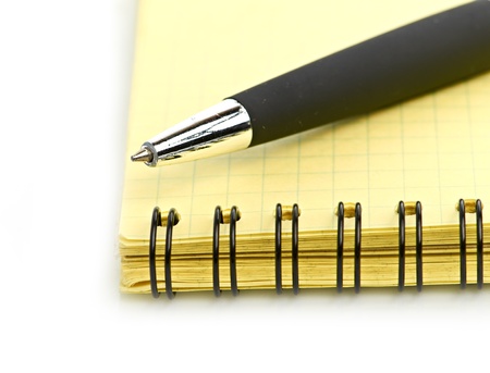 notepad and pen isolated on white backgroundの写真素材
