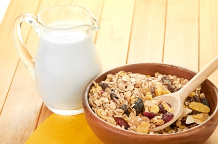 Plate with raw oatmeal on wooden table.の写真素材
