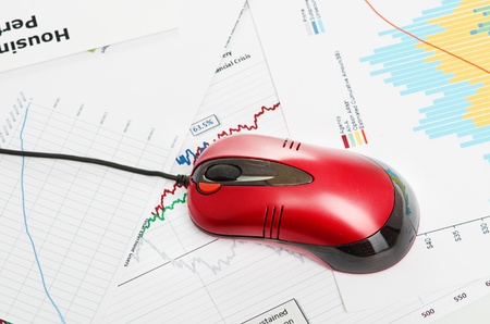 financial graph with computer mouseの写真素材