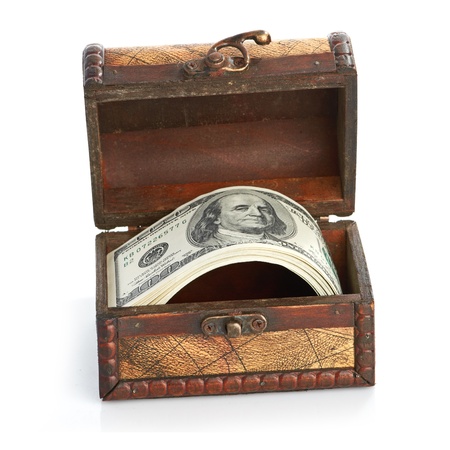 Dollar-bills in the old wooden treasure chestの写真素材