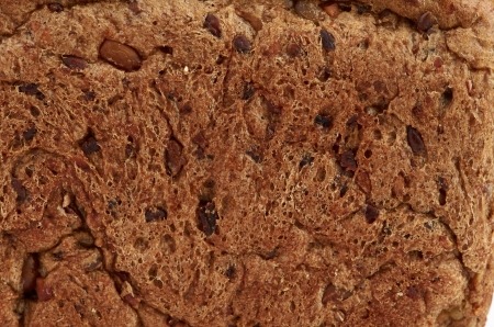 background texture of a porous brown breadの写真素材