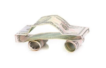 car made from dollar isolated on white backgroundの写真素材