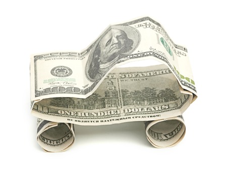 car made from dollar isolated on white backgroundの写真素材