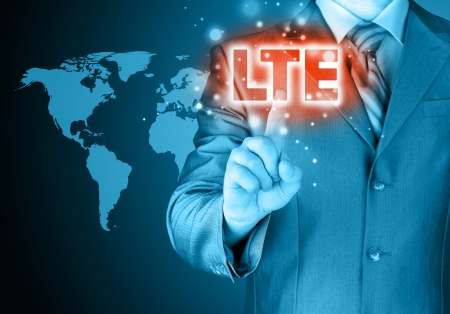 businessman is pushing his finger on lte buttonの写真素材