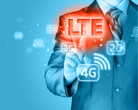 businessman is pushing his finger on lte buttonの写真素材