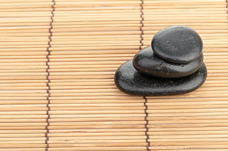 The spa a stone on bamboo backgroundの写真素材