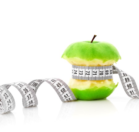 white measuring tape and appleの写真素材