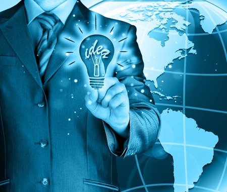 Business man touching light of ideaの写真素材