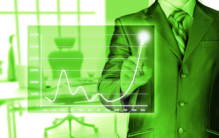 Business man touching light of ideaの写真素材