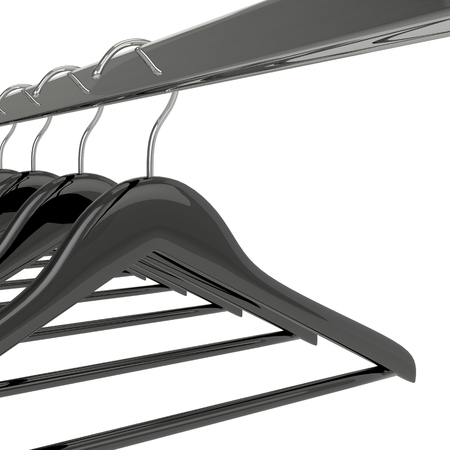 Black clothes hangers isolated on whiteの写真素材