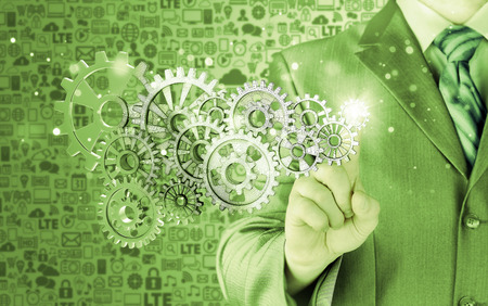 businessman hand touch  gear to success conceptの写真素材