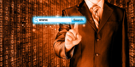 Businessman pushing virtual search barの写真素材