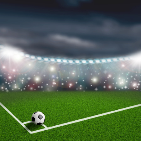soccer ball on the green field cornerの写真素材