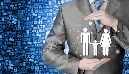 businessman protecting family Insurance conceptの写真素材