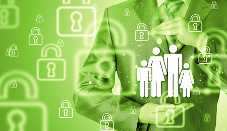 businessman protecting family conceptの写真素材