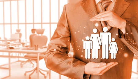 businessman protecting family Insurance conceptの写真素材