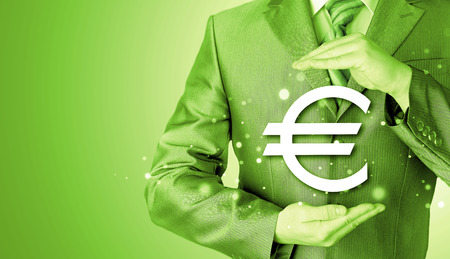 businessman protecting euro symbolの写真素材