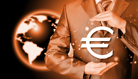 businessman protecting euro symbolの写真素材