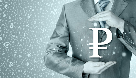 businessman protecting ruble symbolの写真素材