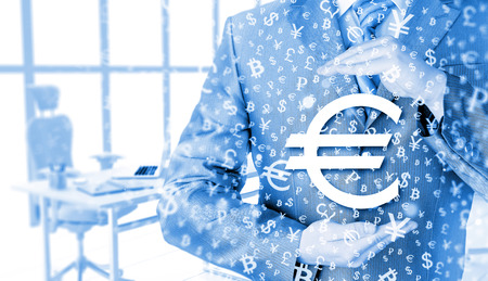 businessman protecting euro symbolの写真素材
