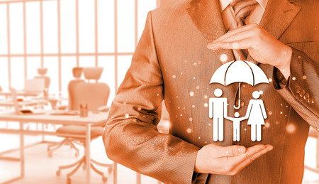 businessman protecting family Insurance conceptの写真素材