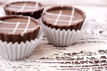 Dark chocolate on wooden background