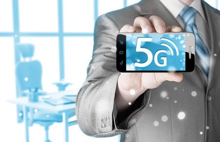 businessman holding in hand 5G, technology backgroundの写真素材