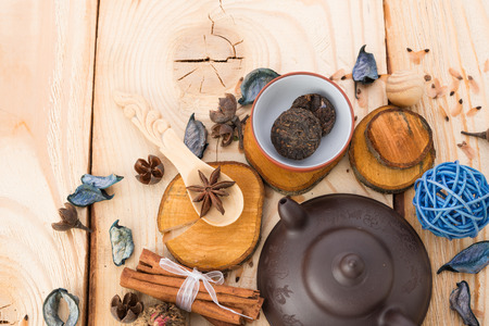 dry tea leaves cinnamon and on wooden backgroundの写真素材