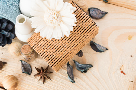 spa stuff, cinnamon and flower with towel on woodの写真素材