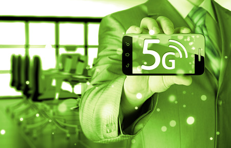 businessman holding in hand 5G, technology backgroundの写真素材