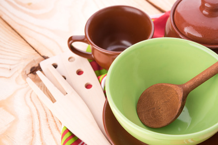 Plates and cups on wooden tableの写真素材