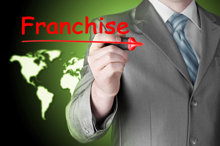 business man writing franchiseの写真素材