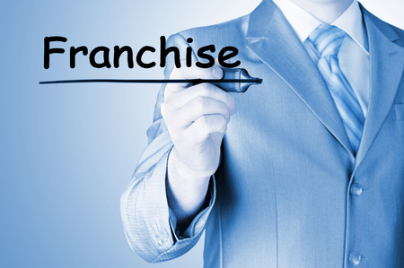 business man writing franchiseの写真素材