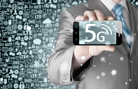 businessman holding in hand 5G, technology backgroundの写真素材