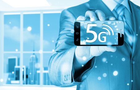 businessman holding in hand 5G, technology backgroundの写真素材