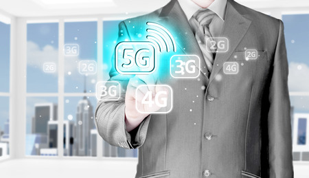 businessman holding in hand 5G, technology backgroundの写真素材