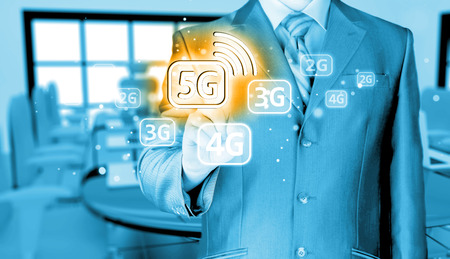 businessman holding in hand 5G, technology backgroundの写真素材