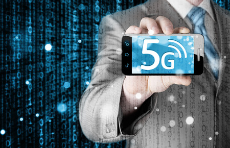 businessman holding in hand 5G, technology backgroundの写真素材