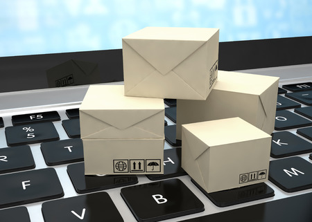 Technology business concept, shipping: cardboard package boxes on laptopの写真素材