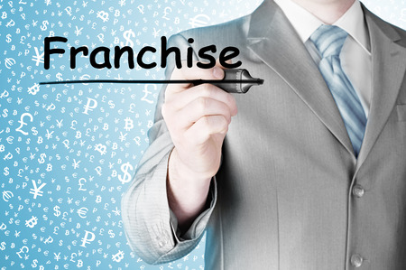 business man writing franchiseの写真素材
